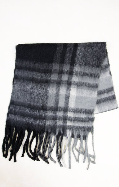 Plaid scarf with black, gray, and white colors on a white background