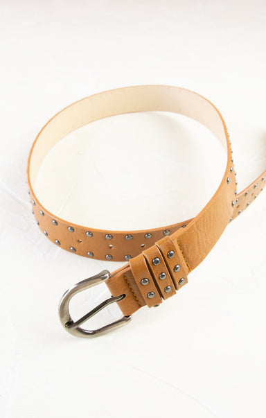 Tan leather belt with studs on a white background