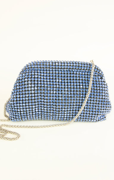 Blue clutch bag with rhinestone embellishments on a white background