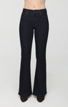 Dark wash flare jeans shown on a model from the waist down, featuring a classic five-pocket design and a flared leg, against a plain light gray background.