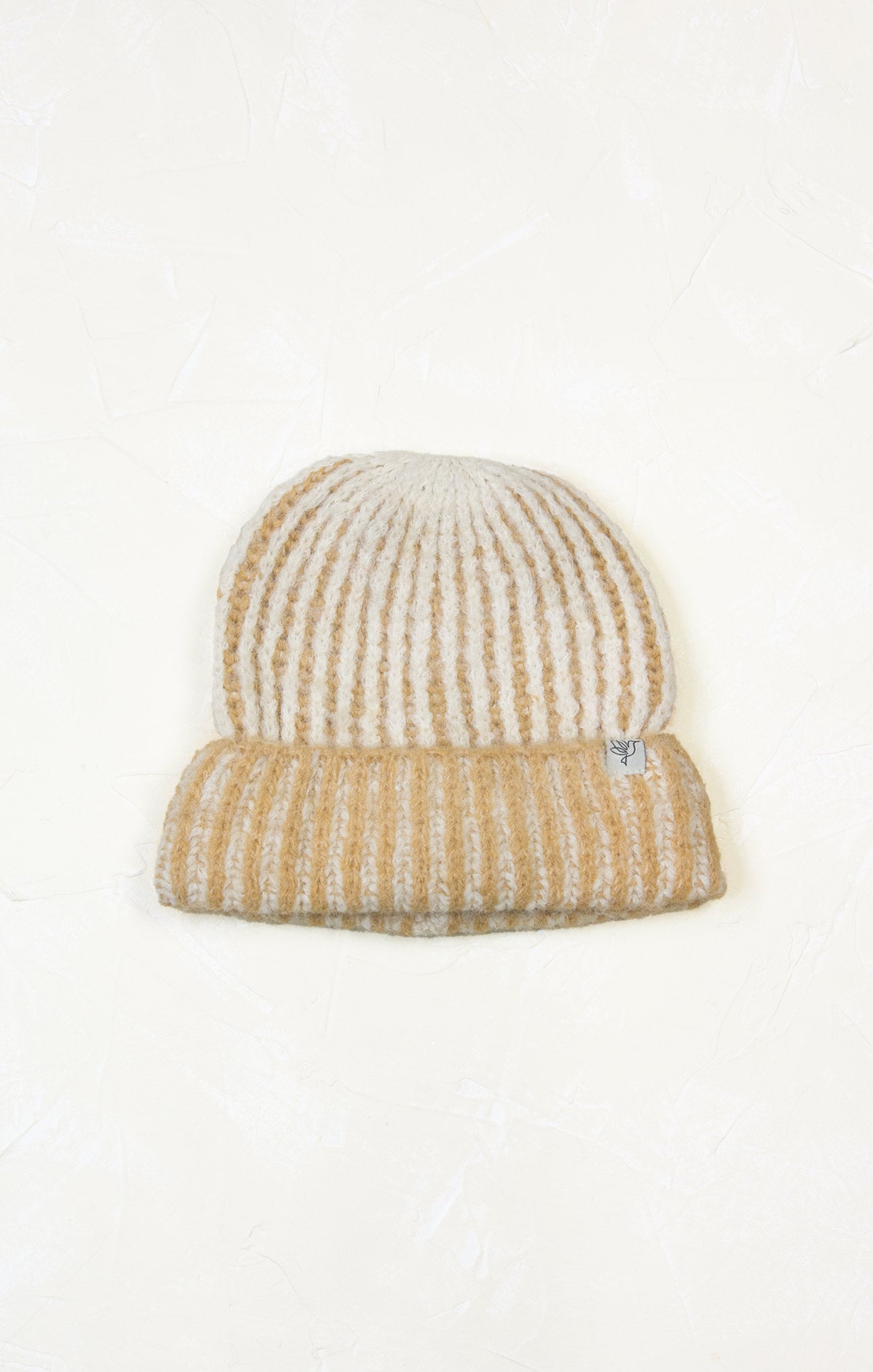 Knitted beanie with a striped pattern on a white background