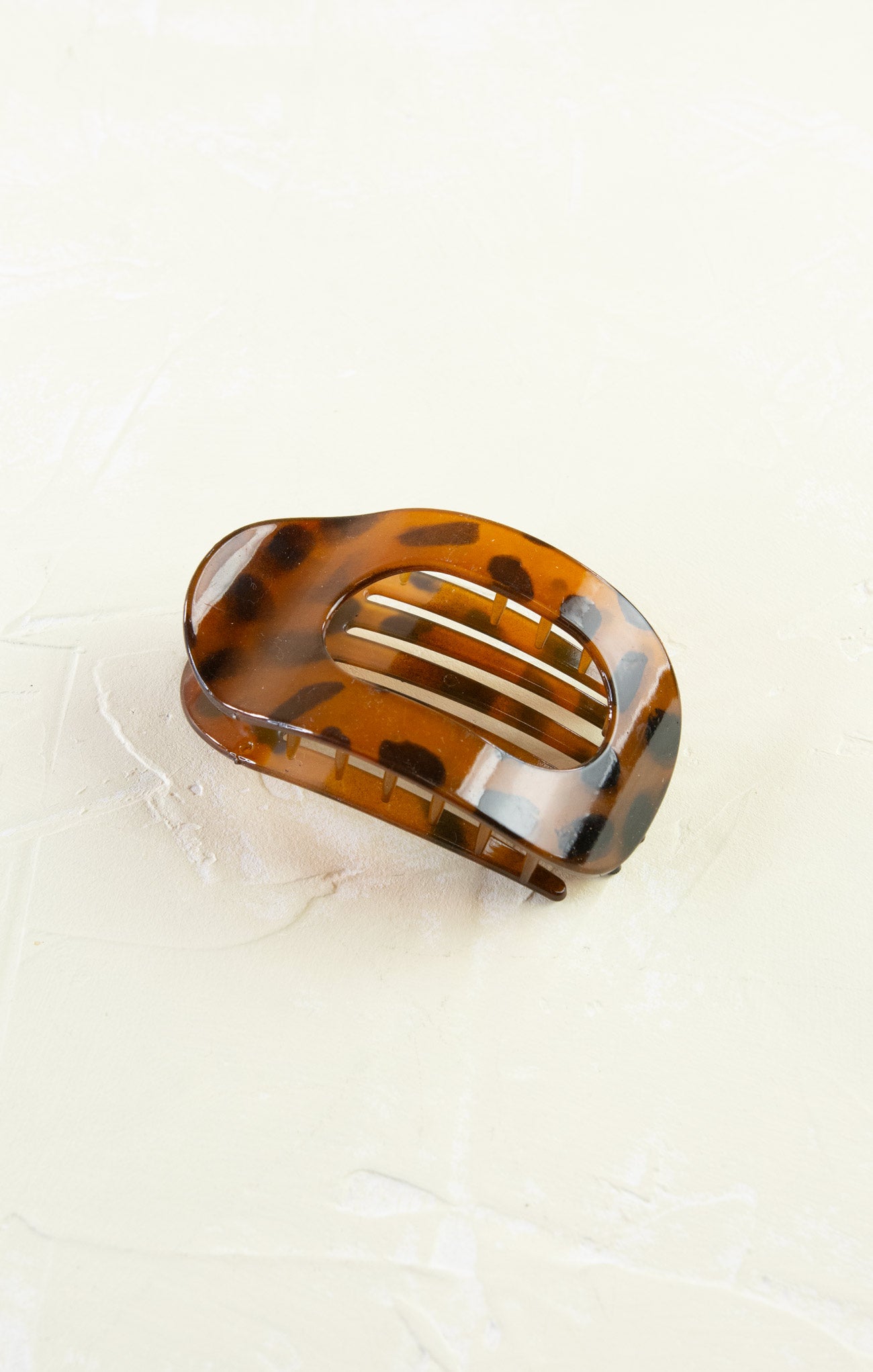 Tortoiseshell hair clip on a white background