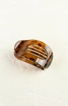 Tortoiseshell hair clip on a white background