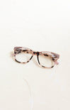 Pair of glasses with a tortoiseshell frame on a white background