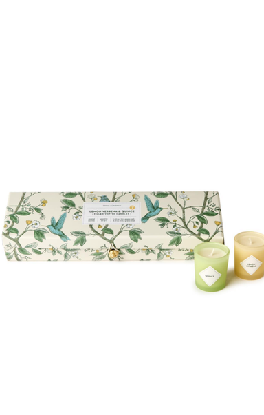 Set of candles with a decorative box on a white background