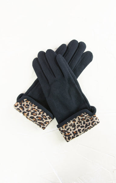 Black gloves with leopard print cuffs on a white background