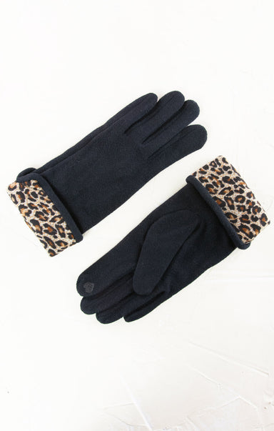 Black gloves with leopard print cuffs on a white background