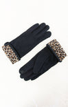 Black gloves with leopard print cuffs on a white background