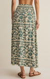 Long floral skirt with green pattern on a neutral background