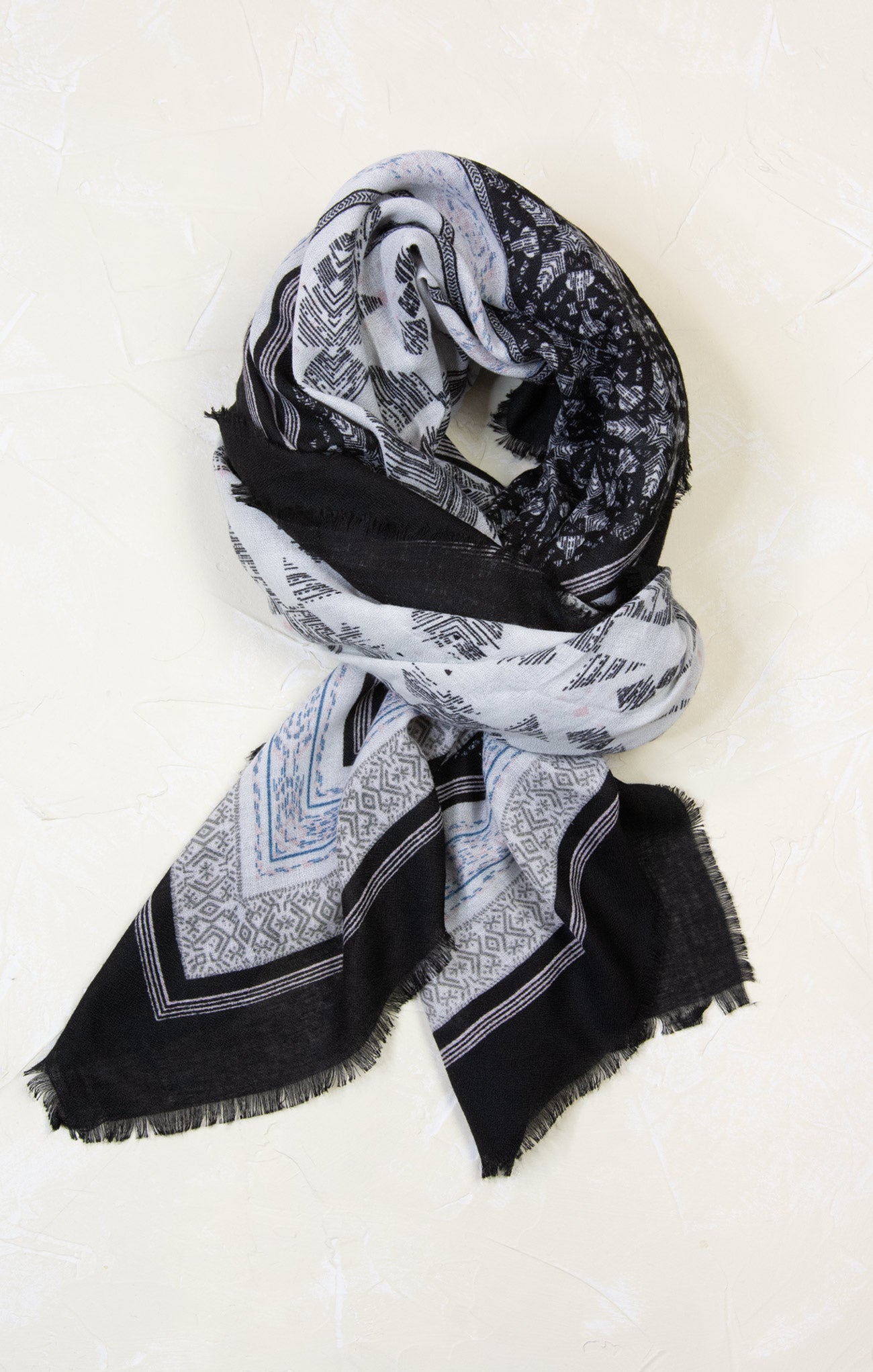 Black and white patterned scarf on a white background