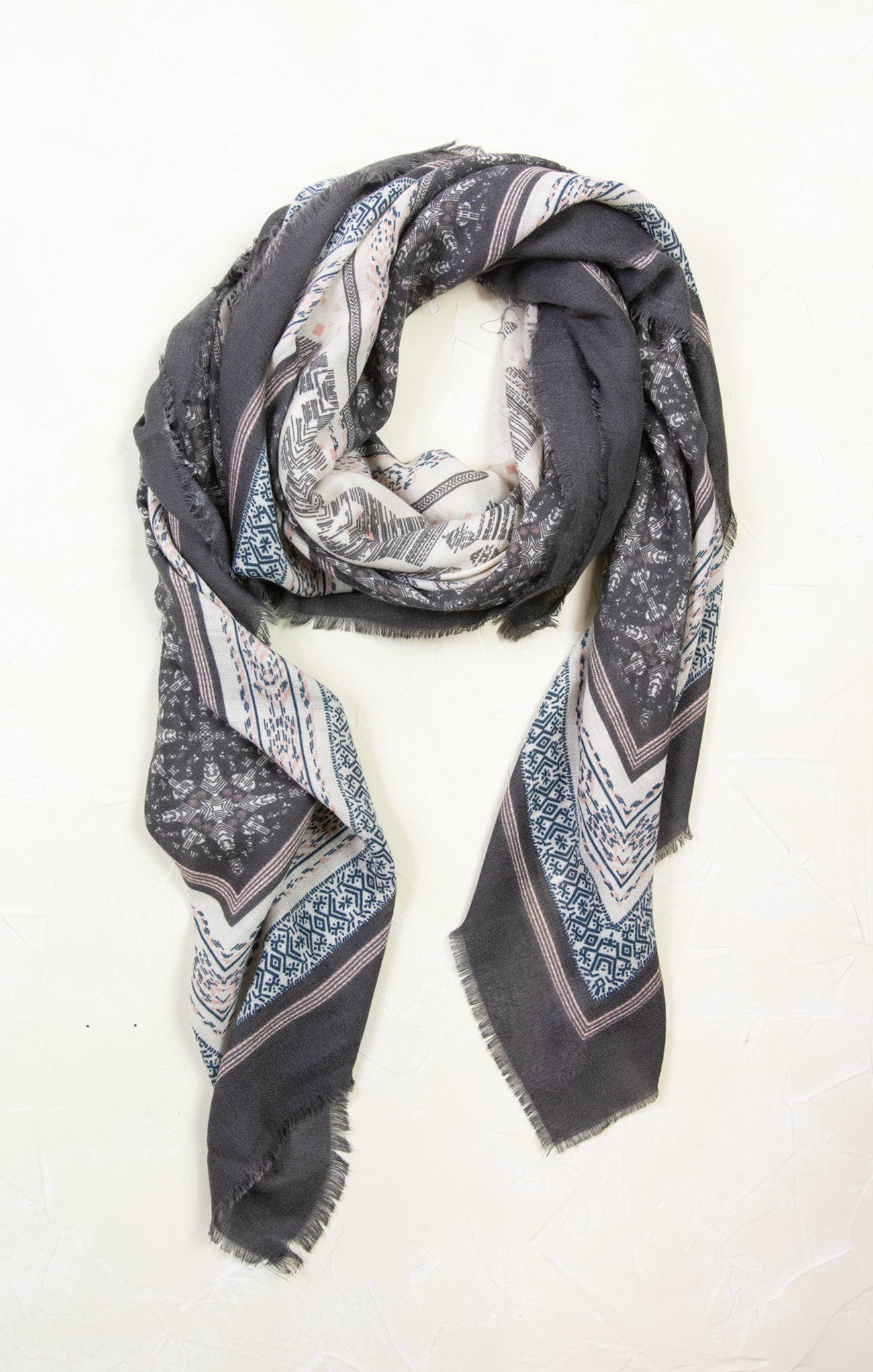 Patterned scarf with blue and gray design on a white background