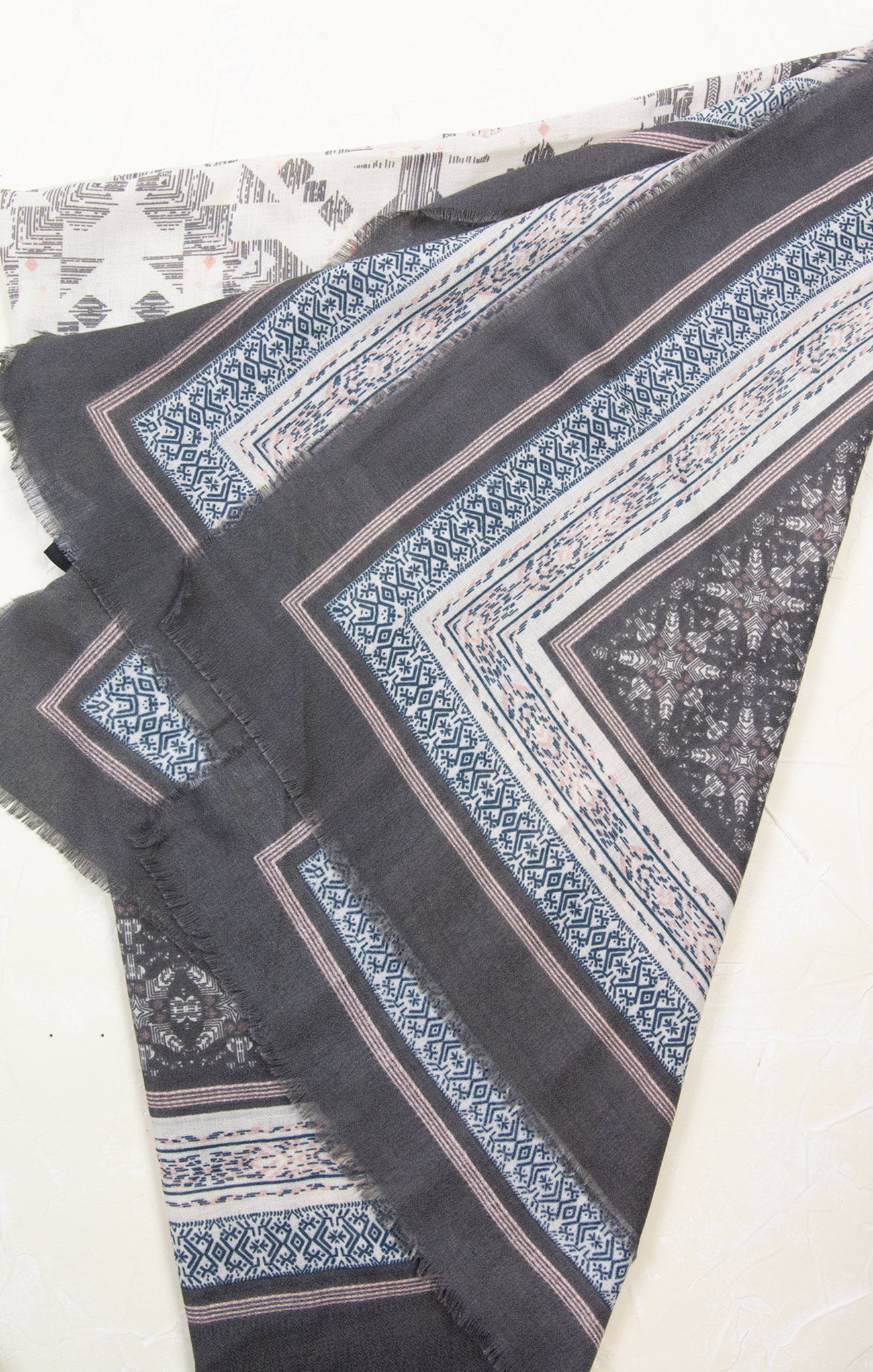 Black fabric with blue and white pattern on a white background