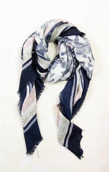 Navy and white patterned scarf on a white background