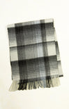 Plaid scarf with black and white pattern on a white background
