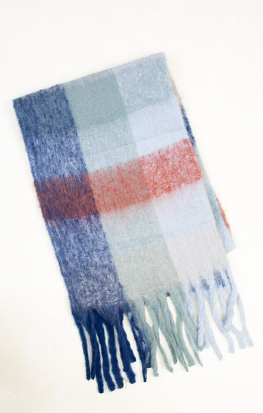 Plaid scarf with blue, red, and white colors on a white background