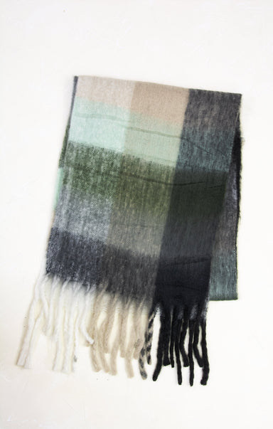 Plaid scarf with fringes on a white background