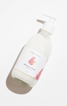 Bottle of Mermaid Kinetics body wash on a white background