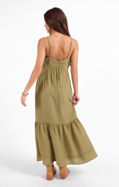 Woman wearing a green dress on a white background
