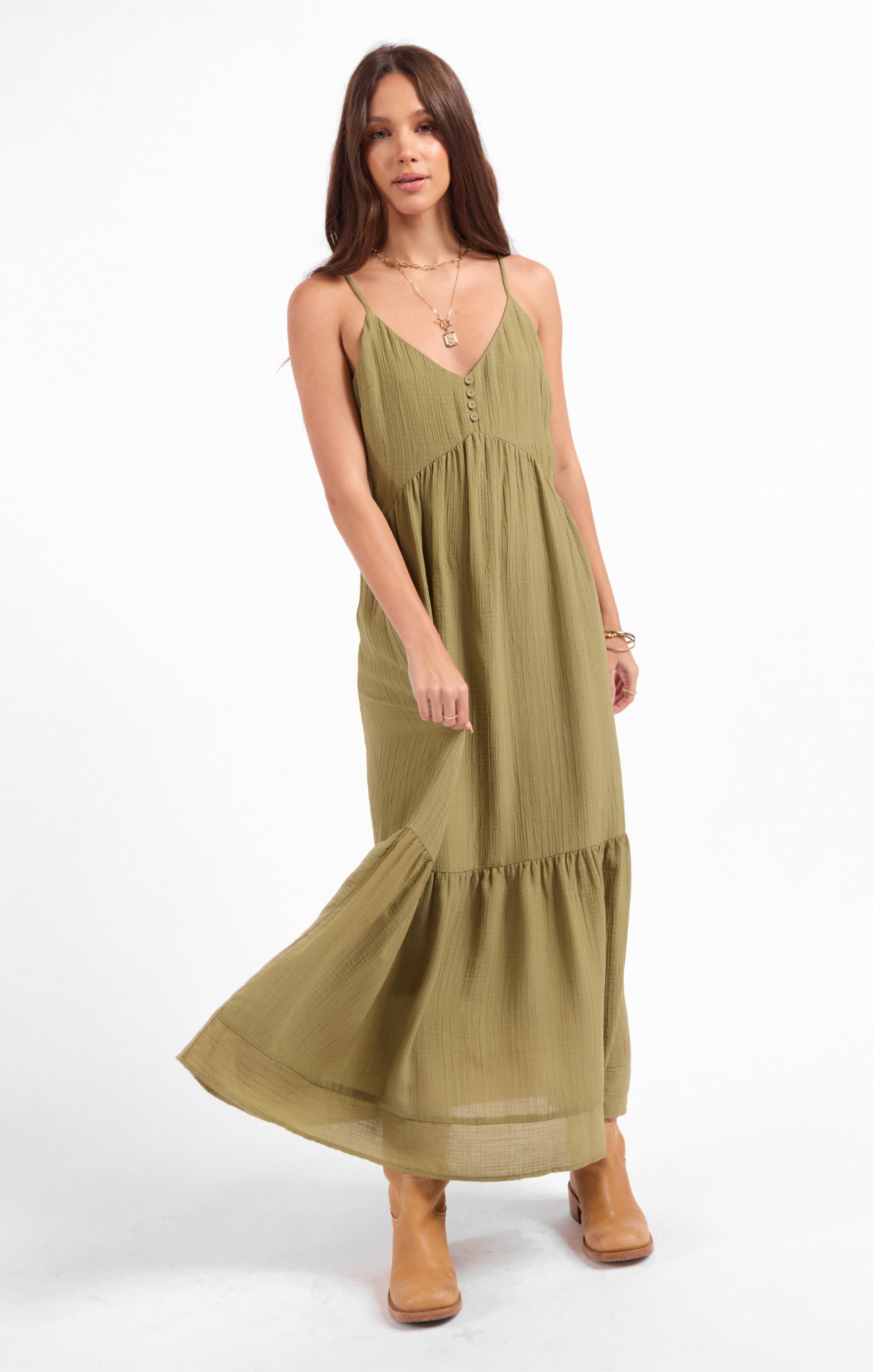 Woman wearing a green dress on a white background