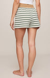 Person wearing green and white striped shorts on a plain background