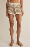 Person wearing striped shorts on a plain background
