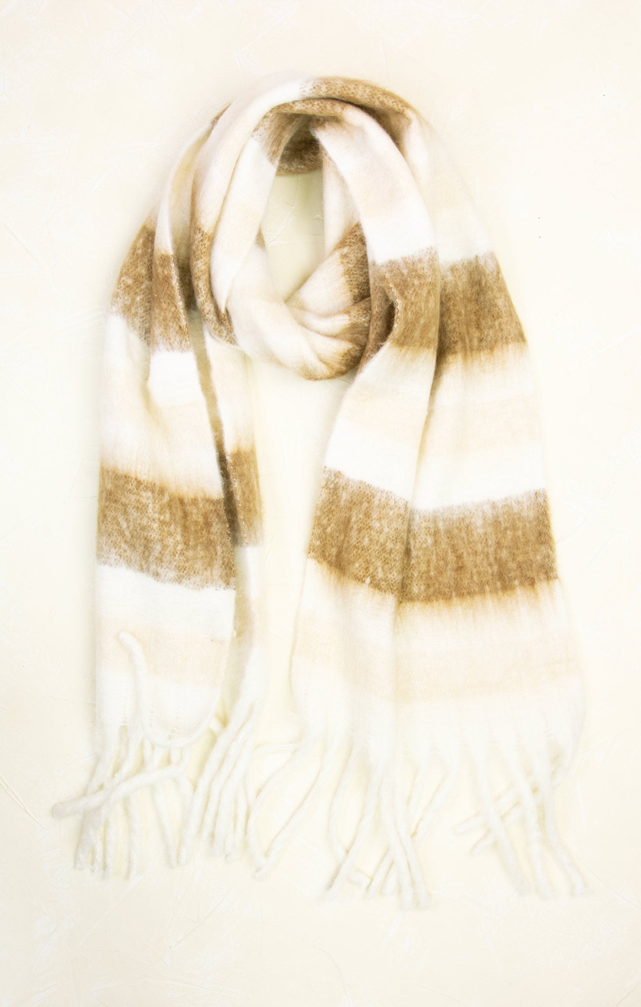 Plaid scarf with brown and beige stripes on a light background