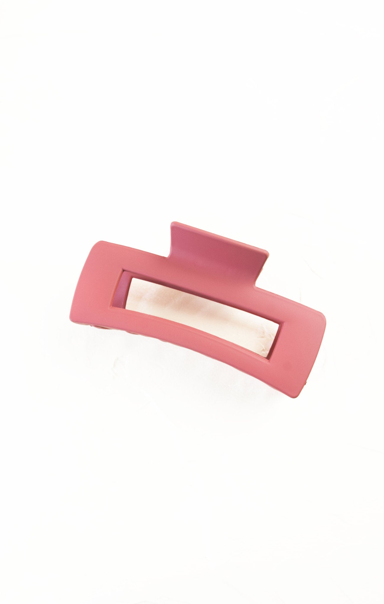 Pink hair clip on a white background