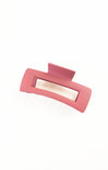 Pink hair clip on a white background