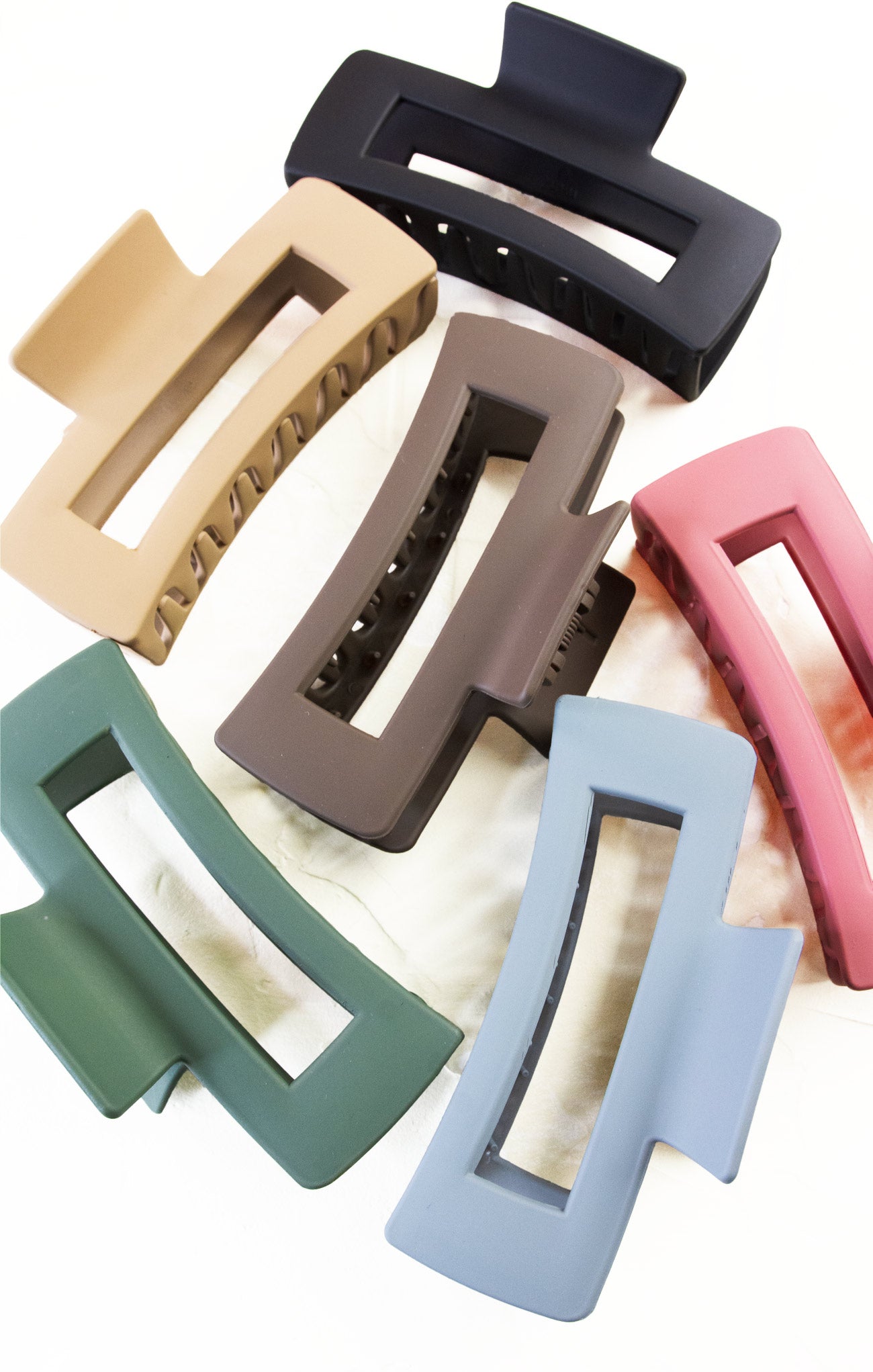 Set of colorful hair clips on a white background