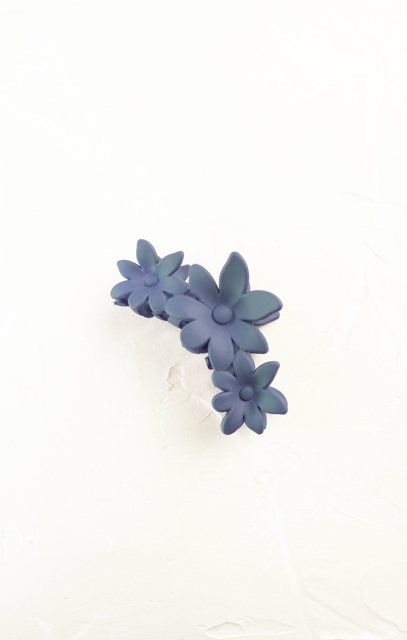 Blue floral earrings on a white background