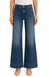 Blue wide-leg jeans worn by a person on a white background