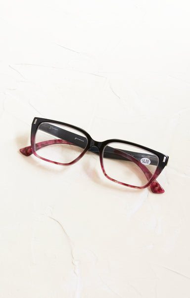 Black and red eyeglasses on a white background