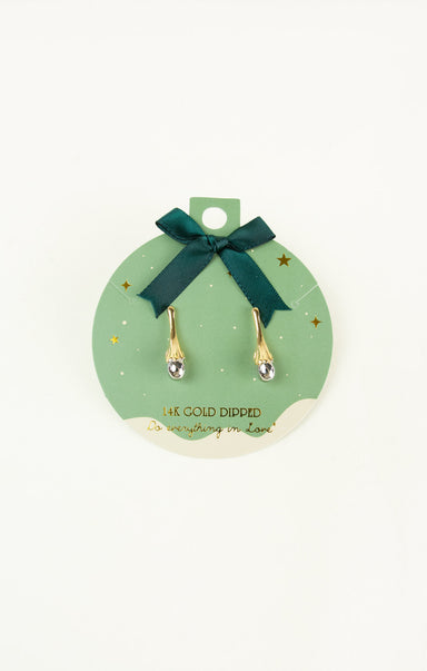Gold-dipped earrings on a green card with a bow