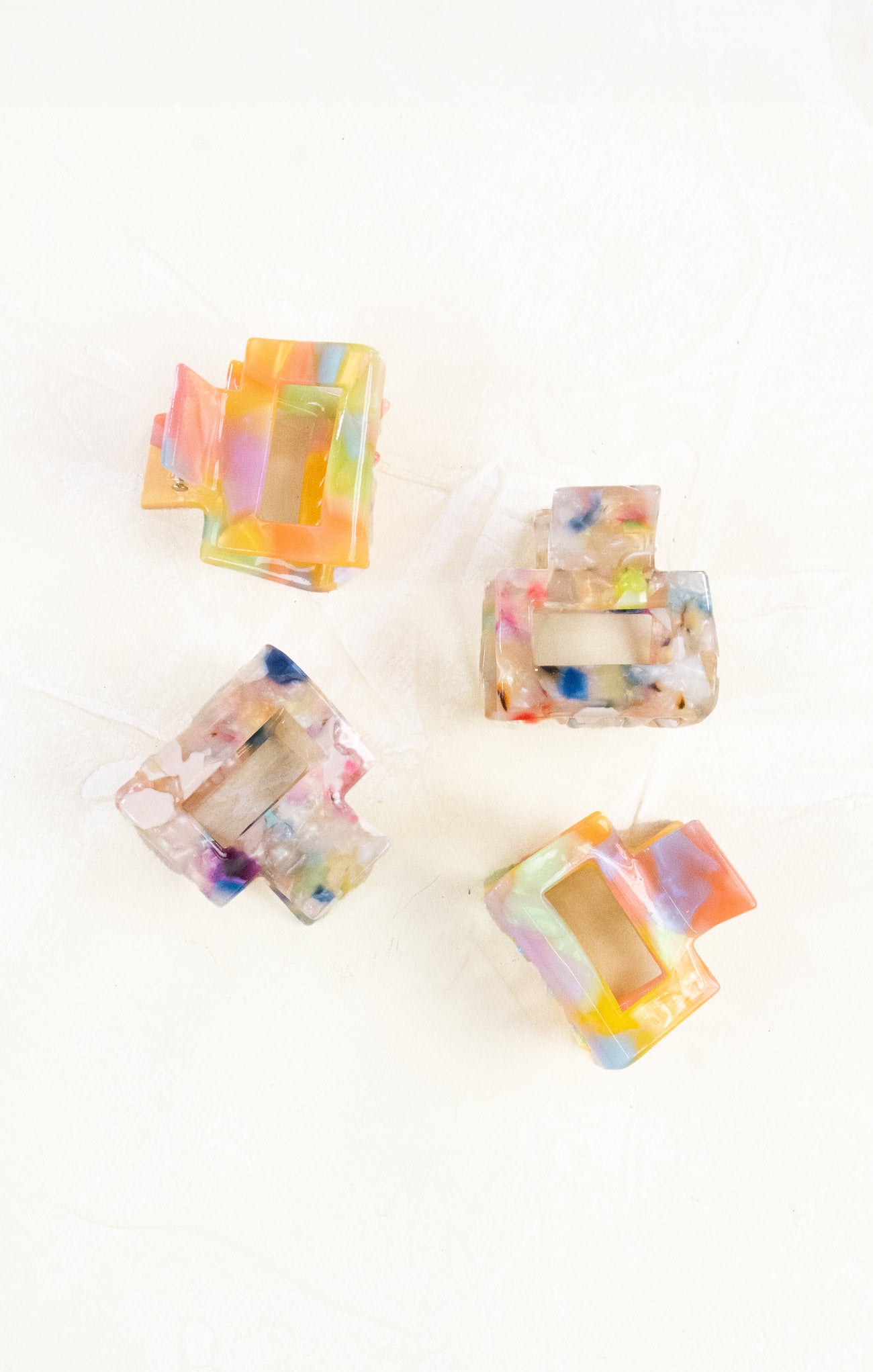 Colorful square candles on a white background