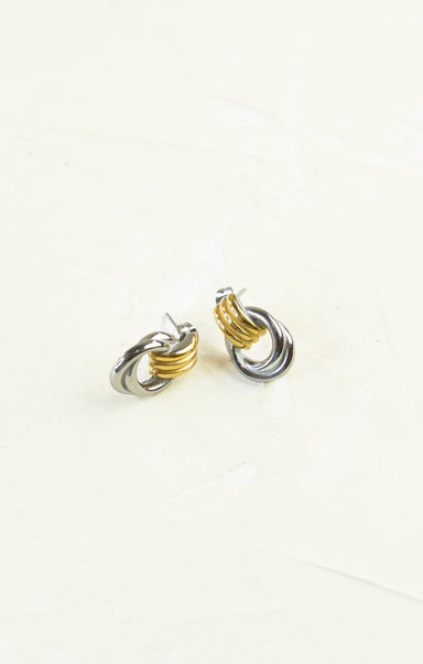 Pair of gold and silver hoop earrings on a white background
