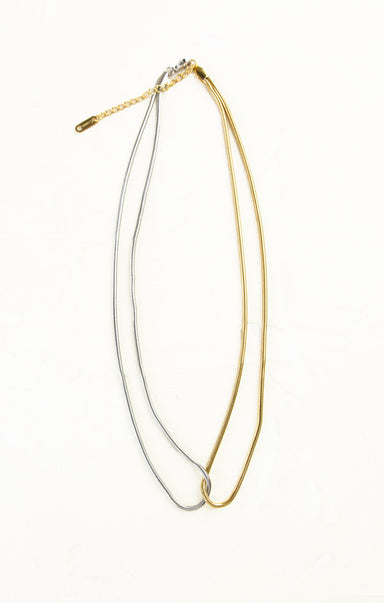 Gold and silver necklaces on a white background