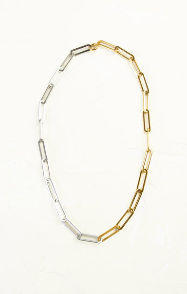 Two-tone gold and silver chain necklace on a white background