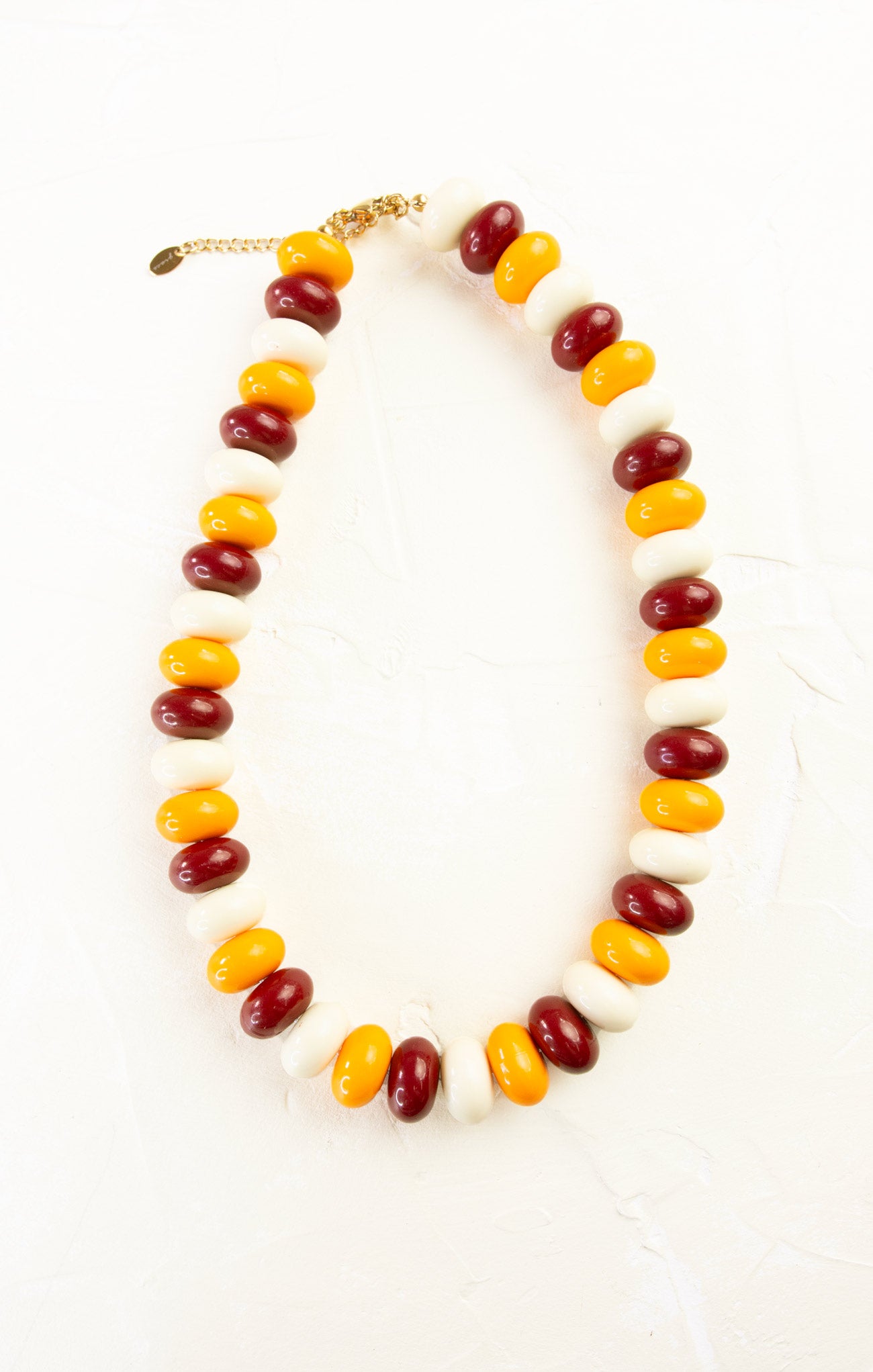 Necklace with multicolored beads on a white background