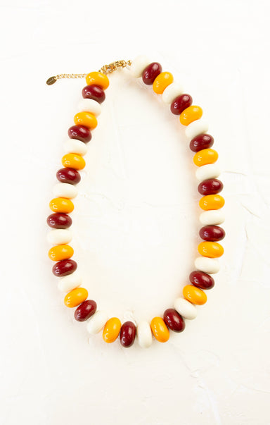 Necklace with multicolored beads on a white background