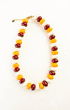 Necklace with multicolored beads on a white background