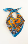Paisley patterned bandana with orange and blue colors on a white background