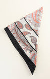 Paisley patterned headband with black trim on a white background