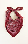 Red paisley patterned bandana on a white background