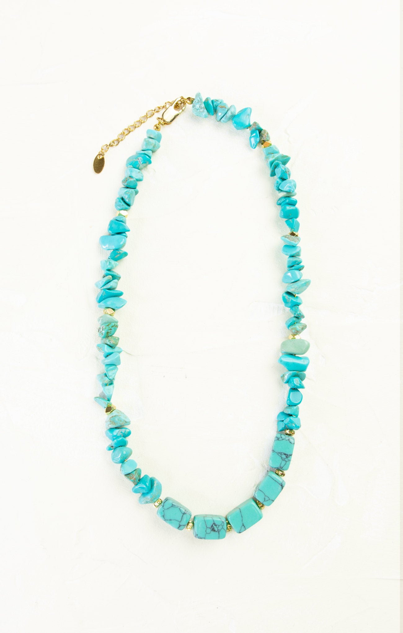 Turquoise beaded necklace on a white background