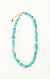 Turquoise beaded necklace on a white background