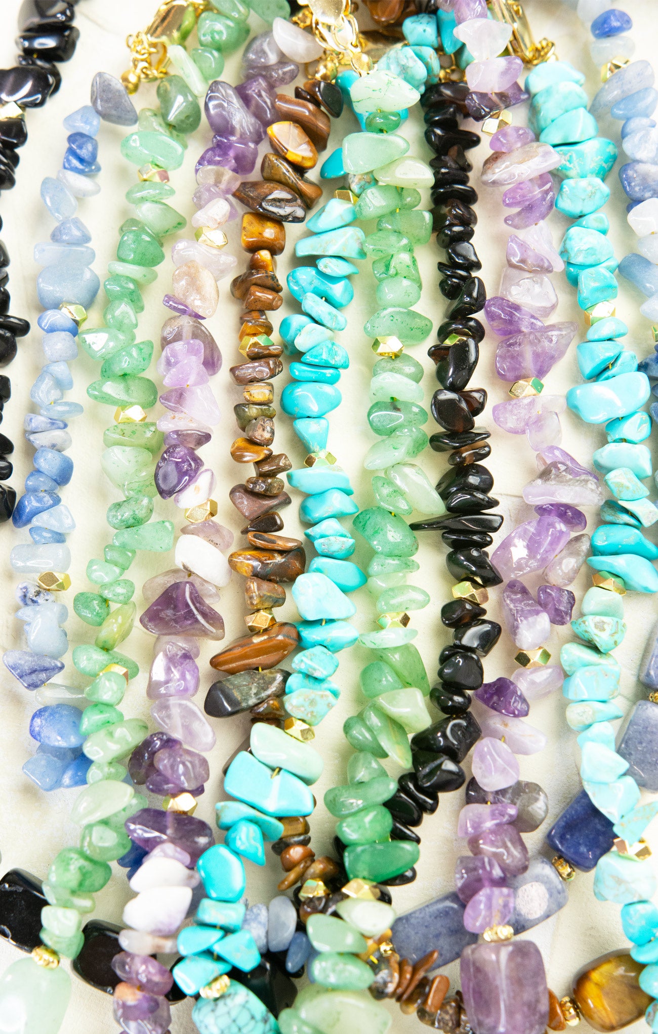 Necklaces with multicolored beads on a white background