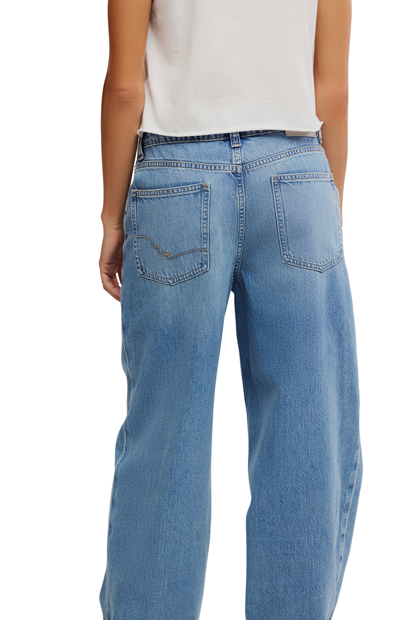 Light blue jeans worn by a person on a white background