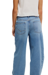 Light blue jeans worn by a person on a white background