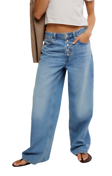 Person wearing blue jeans on a white background