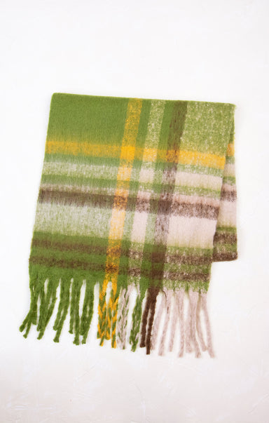 Plaid scarf with green, yellow, and brown colors on a white background
